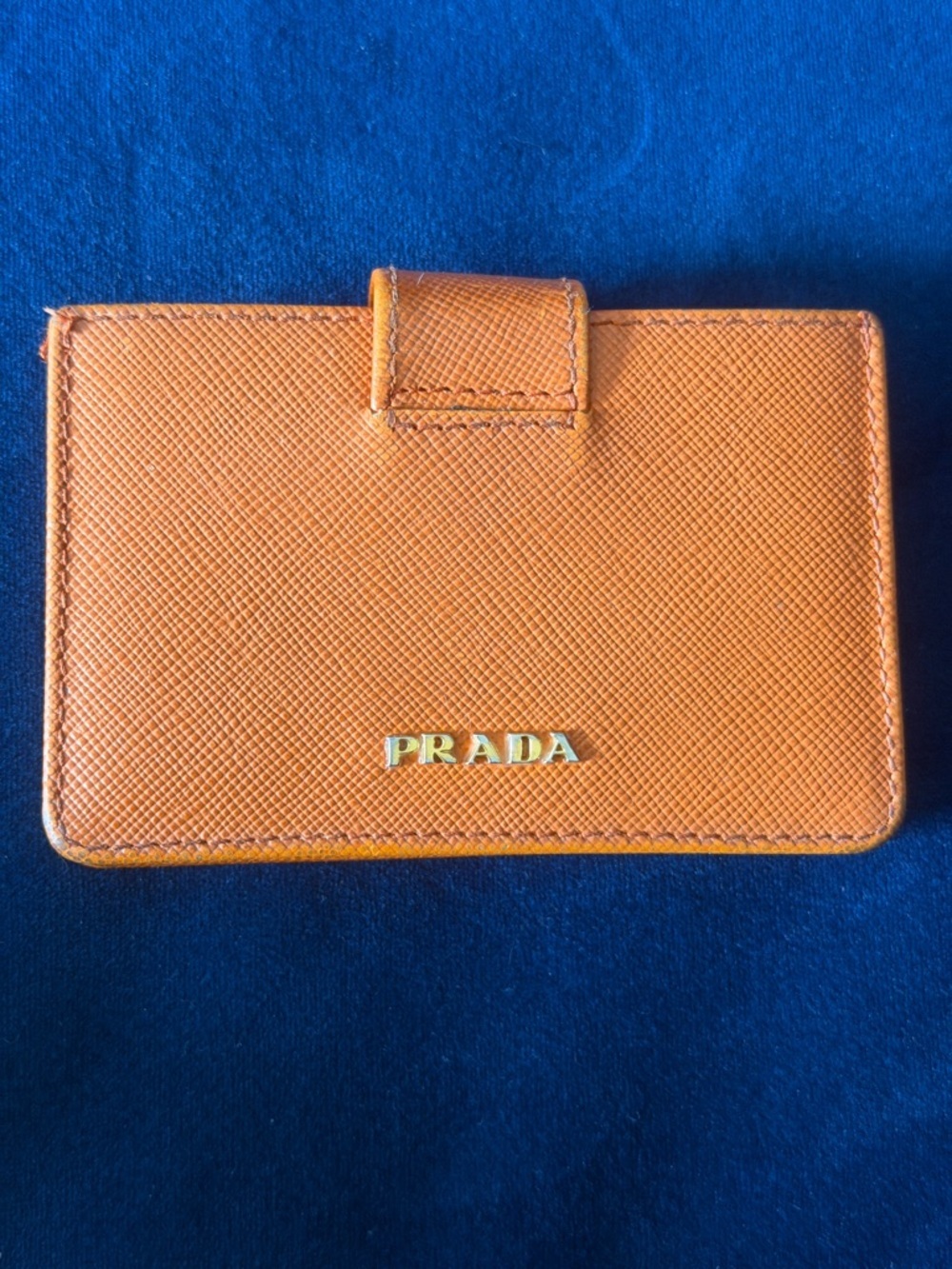 Orange Prada Saffiano Leather accordion card holder.